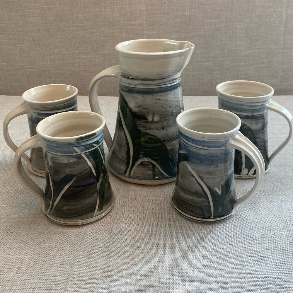 Studio pottery ceramic art pitcher with four mugs signed by Harris.